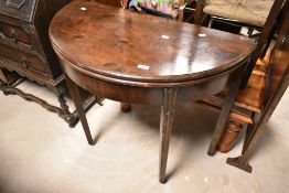 A 19th Century mahogany demi lune fold over tea table, width approx. 90cm