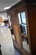 An Edwardian mahogany triple wardrobe having inlay decoration , height approx. 206cm