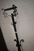 A Victorian wrought metal standard oil lamp stand