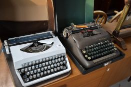 A vintage Imperial typewriter, in grey finish, with zipped case and a Smith Corona typewriter in