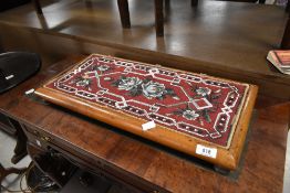 A Victorian beadwork panel/trivet, 55 x 26cm (some damage)