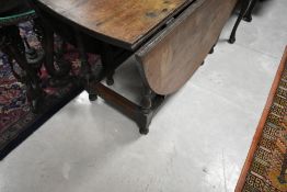 A 19th Century oak gateleg dining table, width approx. 122cm
