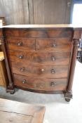 A 19th Century mahogany scotch style chest having bow fronted flame mahogany drawer section (
