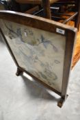 An early 20th Century oak framed tapestry firescreen