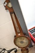 A 19th Century aneroid barometer of onion form , silvered dials named for D Luvate , Preston