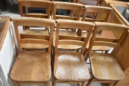 Nine traditional chapel chairs, all with prayer/hymn book troughs to the rear