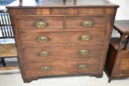 A 19th Century Regency design chest of two over three drawers (plus central 'secret' frieze