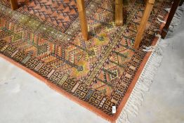 A traditional Turkoman carpet, approx. 200 x 285cm, with woolmark label
