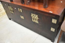 An Oriental double cupboard, directions approx. W138 D47 H60cm