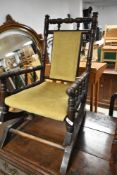 A Victorian childs American rocker having spindle frame, width approx. 40cm