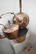 A traditional copper kettle, jam pan and warming pan