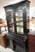 A 19th Century dark stained bookcase or kitchen cabinet comprising glazed display section , with two