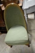 A vintage Lloyd Loom nursing chair