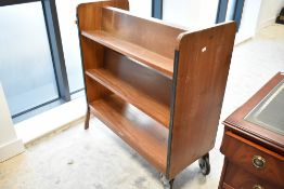 A vintage teak double sided school library portable bookshelf, width approx. 93cm