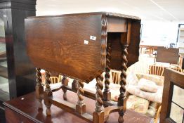 An early 20th Century oak gateleg table having wave edge, approx width 76cm