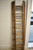 A vintage wooden extending ladder
