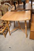 A vintage light Ercol Windsor (model 265) table extenstion, width approx. 68cm (some splitting to