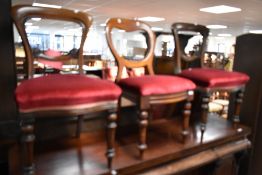 A set of four Victorian mahogany balloon back dining chairs