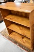A modern yellow pine bookcase, approx dimensions W92 D63 H107cm