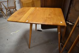 A vintage Ercol Windsor style drop leaf table, approx width 74cm (open length 137cm)