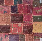 An attractive late 19th century patchwork coverlet fragment, constructed with blocks of material