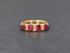 An 18ct gold diamond, ruby and red stone ring, the four cushion cut red stones interspersed with six