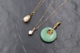 A small selection of yellow metal jewellery including four pendants with chains plus two loose