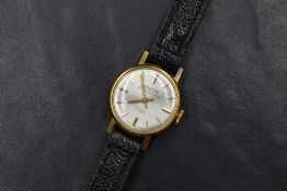A lady's gold plated Montine wrist watch having baton numeral dial to champagne face in circular