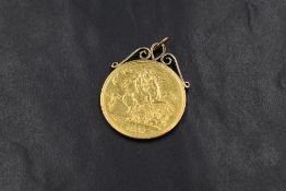 A Victorian 1887 Royal Mint double sovereign, in an unmarked yellow metal scroll mount with