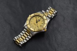 A Tag Heuer Professional 200 Meters wristwatch, the golden dial having baton numerals and date