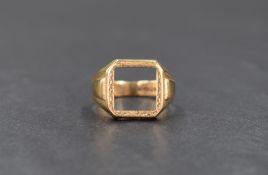 A 9ct gold signet ring, having a vacant square panel with a decorative engraved border, ring size