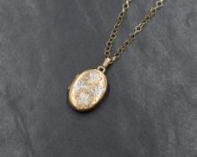 A 9ct gold oval locket having engraved floral decoration, on a fine belcher link chain, approx 18' &