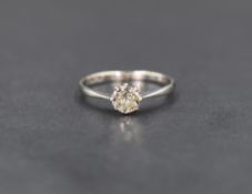 A diamond solitaire ring having an old cut diamond approx 0.4ct in a claw set mount to knife blade