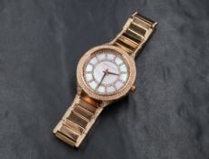 A lady's Michael Kors quartz fashion wrist watch having a diamante set dial to mother of pearl