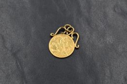 An Edwardian 1903 half sovereign, in an unmarked yellow metal scroll mount with pendant loop, 5.1g