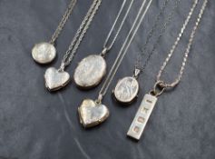 A silver ingot pendant and chain and five silver locket and chains, all of different designs