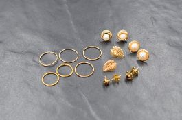 A small selection of 9ct gold and yellow metal earrings for pierced ears including split pearl,
