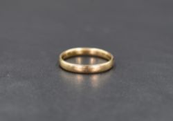 A 9ct gold band, of plain rounded form, ring size M-N, 2.1g