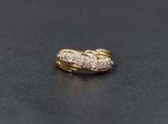 A yellow metal (presumed gold) diamond ring, the two rows of pave set diamonds measuring a total