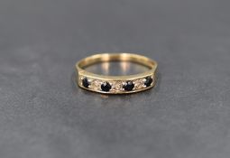 A 9ct gold sapphire and diamond half eternity ring, the four round cut sapphires interspersed with