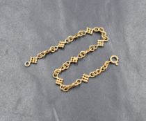 An 18ct gold fancy link bracelet, having infinity style links with beaded links, 16.5cm, 4.6g