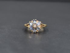 A 9ct gold powder blue sapphire and diamond open cluster ring, having split shoulders and 9ct gold