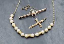 A 9ct gold and cultured pearl necklace, the pearls of cream lustre interspersed with concave gold