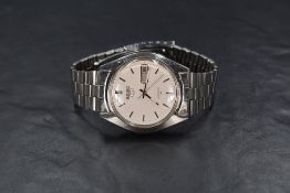 A Seiko 5 automatic wristwatch, the silver dial having baton numerals with date aperture, numbered