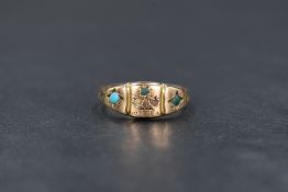 A 9ct gold turquoise gypsy style ring, the three central turquoise cabochons in a flower motif,