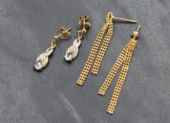 Two pairs of 9ct gold earrings including chain drop and topaz and diamond chip drop, approx 2.6g