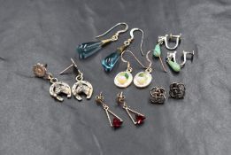Six pairs of silver earrings, including Celtic knot motif studs, blue glass drop earrings and a