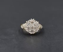 A 9ct gold multi stone diamond chip cluster ring having a cushion mount with diamond set