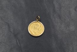A late Victorian 1900 half sovereign, in a 9ct gold surround mount having decorative engraving