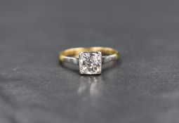 A diamond solitaire ring, having an old cut cushion style stone, approx 0.85ct in a rub over